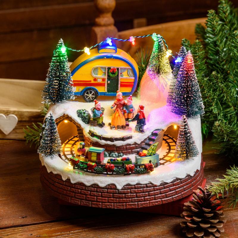 Holiday Villages | Christmas Village, Caravan, Bonfire and Moving Train, h 16 cm, with Christmas Music Figure Lights Holiday Villages